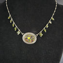 Green Filigree Oval Pendant on a Green Beaded Chain by Nicollette Gamache